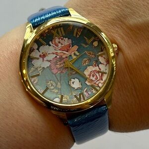 XOXO Gold and Blue Womens Analog Roman Numeral Wrist Watch with Floral Face